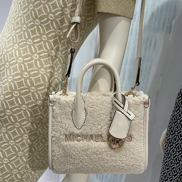 Michael Kors Mirella Extra-Small Sherpa XS SHOPPER XBODY
SHEARLING Crossbody - Picture 16 of 16